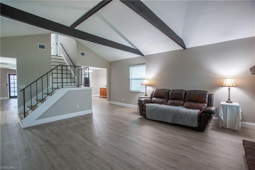 PRICED TO SELL! THIS HOME IS PERFECT FOR ALL YOUR TOYS! This beautifully maintained home offers 1,900 sqft of living space on a generous 0.36-acre corner lot. Not only do they have an oversize driveway, there is a extra driveway behind the house which is 13x70. This home offer a spacious Layout: 3 bedrooms and 2 full bathrooms ideal for family living or hosting guests. A convenient half-bath downstairs adds to the home's functionality. The main level boasts a cozy living room anchored by a wood-burning fireplace, a formal dining area, and a family room. Agua Guard water proof wood-based laminate flooring flows throughout the whole home. The kitchen features 2-yr old stainless-steel appliances, a breakfast bar, and formal dining room which are perfect for casual meals and entertaining. Upstairs, the master bedroom features sliding glass doors that open to a private, two-story balcony—your serene vantage point for morning coffee or evening relaxation. Enjoy Florida living in the spacious lanai surrounding a sparkling in-ground pool and accented with a decorative pool deck. The lush .36-acre lot includes a 12×20 shed with a loft, insulated, and equipped with electricity and mini-AC—an ideal spot for a workshop or hobby space. Attached two-car garage plus a single-car carport. The first-floor was updated with a new air conditioning system and the home is built on a durable slab foundation with a metal roof .