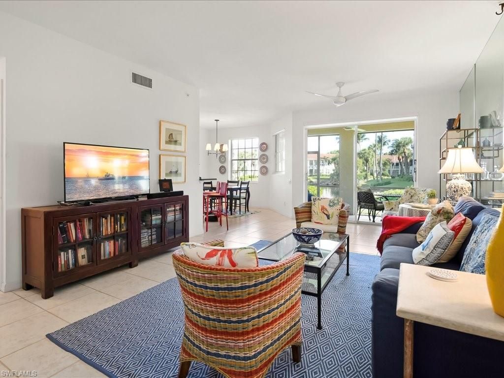 Photo of 200 L AMBIANCE CIR #102, NAPLES, FL 34108 (MLS # 225072818)