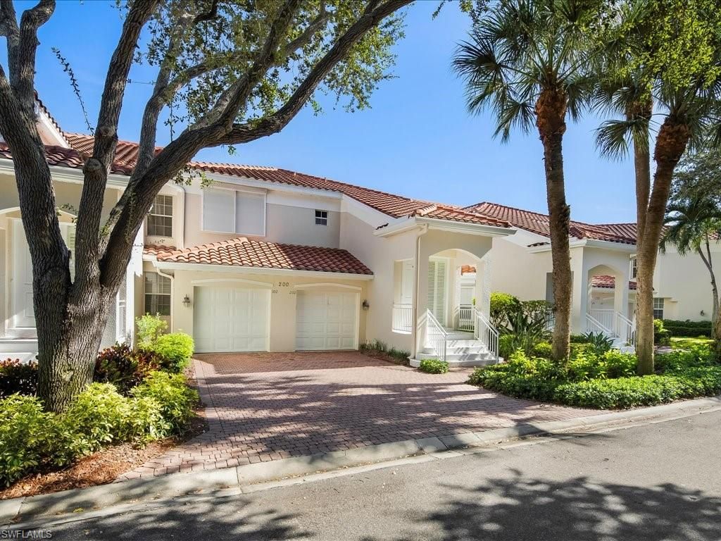 Photo of 200 L AMBIANCE CIR #102, NAPLES, FL 34108 (MLS # 225072818)
