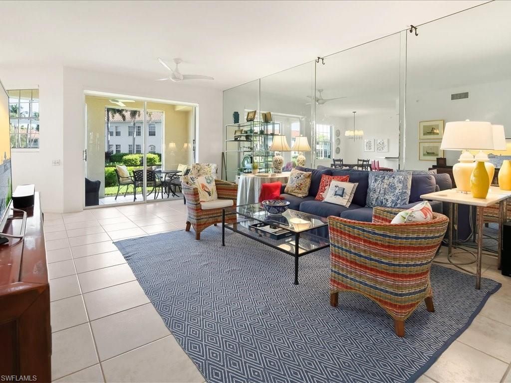 Photo of 200 L AMBIANCE CIR #102, NAPLES, FL 34108 (MLS # 225072818)