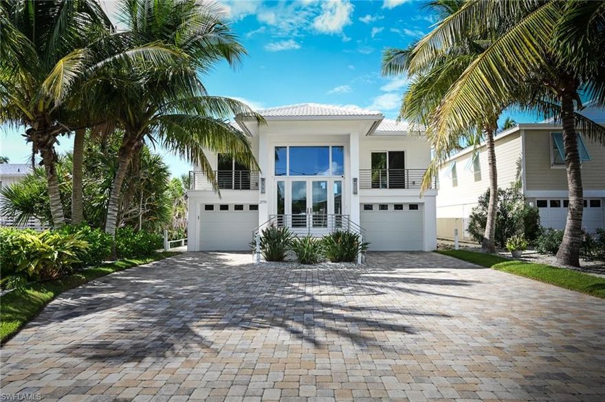 Lowest priced direct beach front home on Bonita Beach! This coastal style renovated home features five bedrooms and three baths. Hurricane impact glass and electric shutters. Open floor plan with volume ceilings. The master suite is located on the beach. Many outstanding amenities include quarter sawn cherry Amish kitchen cabinets, marble flooring, granite counter tops, high quality fixtures and appliances including induction range, two zone Subzero wine fridge and touch faucet.  Three car garage. Fantastic Gulf of Mexico views!