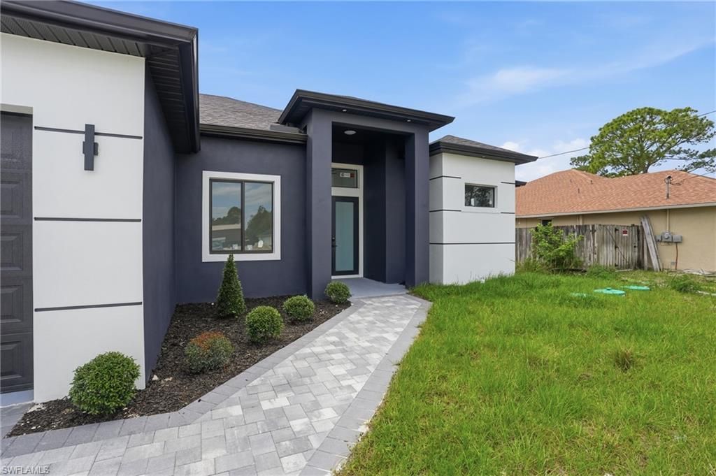 Photo of 3409 24th ST SW, LEHIGH ACRES, FL 33976 (MLS # 226016003)