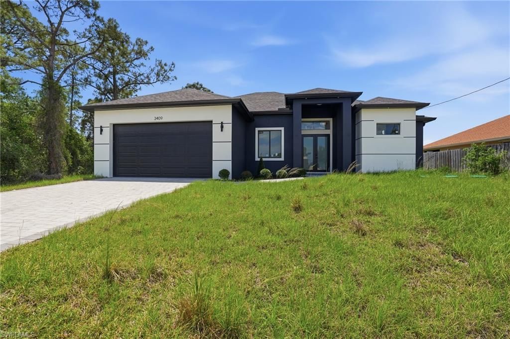 Photo of 3409 24th ST SW, LEHIGH ACRES, FL 33976 (MLS # 226016003)