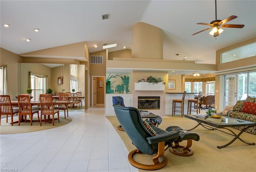 Bright and open home with high ceilings, features a split floor plan. This 3 bedroom, 2 1/2 bath, pool home, in highly desirable Mahogany Run, phase 1 in Gateway features 2 fireplaces and an elegant design. Great room has a large wall of sliding doors that lead to a spacious lanai and pool area.  Kitchen plus bar have remodeled, light color wood cabinets, granite countertops, stainless steel appliances, a glass top stove, and wall ovens, plus a great pantry. Large Master suite has sitting area, and opens to the lanai, master bathroom with double sink vanity has walk-in closet and shares a fireplace with master bedroom. 2nd bedroom has Murphy bed and with a built-in desk.  3rd bedroom has access to pool lanai, with new paint and carpet.  Oversized corner lot with an expansive driveway, extra large 2 car garage.  24/7 manned gate house, Low HOA @ $360/Qtr w/ basic cable included!