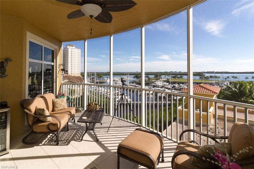 Love boating or even just the water? You will enjoy these spectacular water and marina views all day! This is a spacious three bedroom with a den and nearly 2900SF of living area, 2 terraces, private 2-car garage and private elevator lobby. The kitchen has beautiful wood cabinetry, granite counters and an eat-in area with a water view. The kitchen has a bar top to the living area providing open space for entertaining. Both guest rooms and the den have sliding glass doors to the expansive terrace with views of Cape Coral. This unit has a newer A/C with Fresh Aire UV Purity and water heater and has whole unit water filtration. Enjoy living the resort dream all year, this IS resort living! The lushly landscaped pool area features a beach-walk entry pool, spa and gas grills. Lounge under the palm trees pool side and watch the boats and yachts in the marina .you can enjoy all the amenities of this exquisite community...exercise at the fitness centers, swim laps, do water aerobics, play tennis, even practice your putting. Keep your boat at the marina or rent a boat, paddle board, kayaks or take a dolphin sunset cruise right from the marina. Enjoy restaurants and shops, or have a Spa Day.