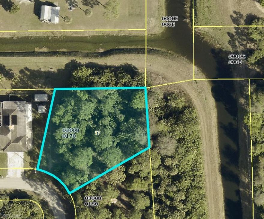 This 1/2 acre lot is located on a corner that has 2 rear canals - one canal is on the north side of the property  and the other canal is on the eastern side.   Great opportunity to build your dream home in in a highly desirable location of Lehigh Acres.   Located close to schools, shopping airport, I-75, restaurants and beaches. These lots are selling fast and there is a limited supply.