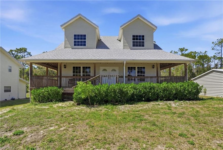 Escape to your own private retreat with this charming country-style home nestled on a spacious half-acre lot! From the moment you arrive, the inviting wrap-around porch sets the tone for relaxed living and peaceful surroundings. Step inside to discover a warm and welcoming interior filled with natural light pouring through open living spaces. The home features beautiful wood walls on both levels, complemented by rich solid oak flooring that adds timeless character and durability throughout. The thoughtfully designed layout offers 2 bedrooms plus a versatile den perfect for a home office, guest space, or hobby room along with 2 well-appointed bathrooms. A cozy loft area adds additional flexible living space, ideal for a reading nook or additional lounge area. Enjoy peace of mind with recent updates including a 2022 roof, brand-new tankless hot water heater, and a durable metal garage built in 2018—perfect for storage, workshop needs, or recreational equipment. Whether you're sipping coffee on the porch or enjoying the tranquility of your expansive lot, this home perfectly blends comfort, style, and modern updates with the charm of country living. Don’t miss your opportunity to make this unique property your own!