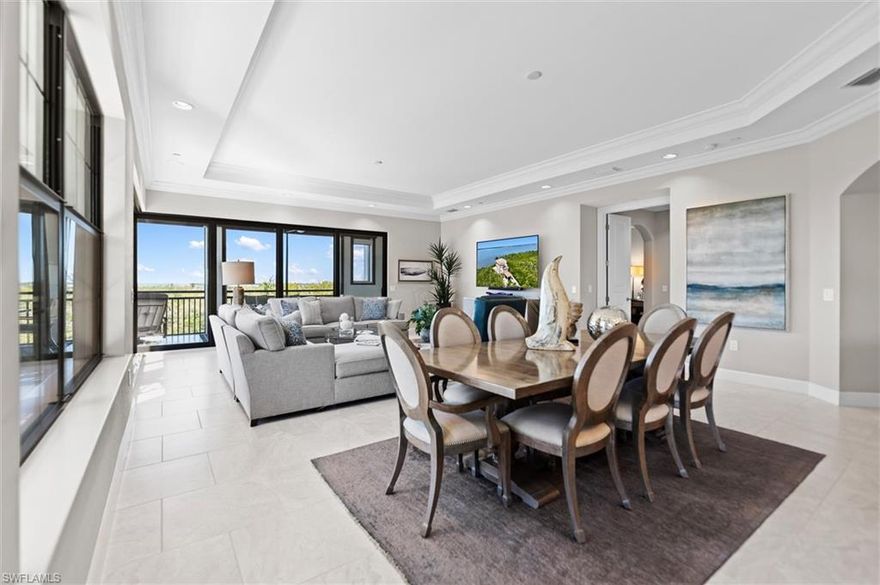 Refined luxury meets effortless living in The Colony. Step into the refined ease of this impeccably furnished residence in The Colony, where nearly 3,000 square feet of thoughtfully curated living space blends the privacy of a single-family home with the low-maintenance appeal of luxury condominium living. This 3-bedroom + den, 3.5-bath sanctuary is tucked against a serene nature preserve, offering unparalleled peace and privacy—your own private retreat in the heart of Bonita Springs. From your private elevator foyer, you’re welcomed into an expansive, light-filled open-concept living and entertaining space. Dramatic corner stacking sliders disappear to reveal a sweeping wraparound lanai—perfect for seamless indoor-outdoor living. Storm-rated screens ensure year-round comfort and effortless lock-and-leave peace of mind. At the heart of the home, the kitchen is as stylish as it is functional, featuring sleek white cabinetry, gleaming stone countertops, high-end stainless steel appliances, a gas cooktop, and dedicated beverage and wine coolers. Whether you're hosting a dinner party or preparing a quiet meal at home, this space delivers both form and function. Designed for ultimate flexibility, this residence offers dual primary suites, along with a beautifully appointed guest suite and a spacious den or home office that opens directly to the lanai. As a resident of The Colony at Pelican Landing, you’ll enjoy an exclusive collection of resort-style amenities: private beach park with staffed pavilion and shuttle service, private Bay Club dining overlooking Estero Bay, tennis, pickleball, fitness center, kayak parks, and miles of walking and biking paths. A quick jaunt to the airport, shopping and dining, here, luxury isn’t just a home—it’s a lifestyle