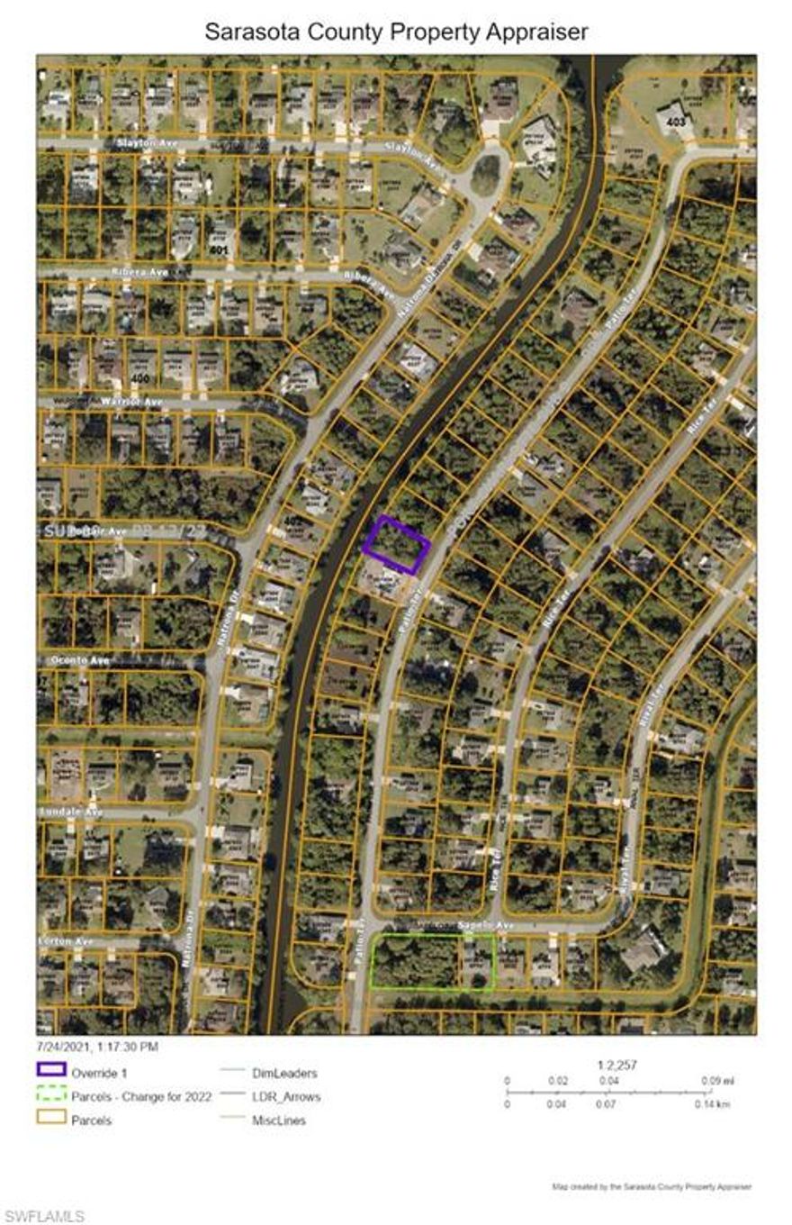 Nice wooded lot on a canal on a  quiet residential street.