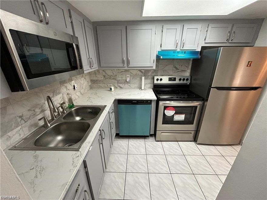 Whether you're looking for a primary residence or a strategic addition to your investment portfolio, this ground-floor unit in the Windsor West community of Fort Myers offers the perfect blend of comfort and convenience. Featuring two bedrooms and one bathroom across 962 square feet of living space, the interior is finished with durable tile flooring throughout. Recent upgrades include a brand-new water heater and newer kitchen appliances, ensuring the home is move-in ready. The floor plan flows seamlessly to a private, pool-side patio with southern rear exposure, ideal for enjoying the Florida sunshine. This unit also includes one assigned parking space and is located in a secure building with fob entry.

Residents of Windsor West enjoy a range of amenities, including a heated community pool with a refurbished cabana, a fitness center, a library, and meeting rooms. The monthly association fee provides excellent value by covering water, sewer, trash, pest control, landscaping, and exterior building insurance, allowing for a low-maintenance lifestyle. Shared laundry facilities are also conveniently located on-site. The property's central location provides a Walk Score of 72, placing you within walking distance of Edison Mall and Winkler Park, and just a short five-minute drive from the dining, shopping, and entertainment of the Downtown Fort Myers River District.

With its prime ground-floor location, essential upgrades, and proximity to major medical centers and downtown amenities, this condo represents an exceptional opportunity in the Southwest Florida market.