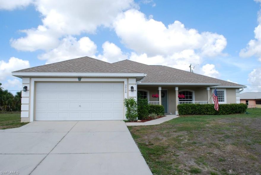 This beautiful home is already on city water with the assessment paid.  Located on a corner lot with western exposure to enjoy the gorgeous Florida sunsets.  A large living room with eat in kitchen is the heart of this home.  A large master bedroom with his and hers walk in closets is complimented by a master bath with dual sinks, jetted tub and separate shower.  Split floor plan with large guest bedrooms.  There is a formal dining room for family gatherings and a separate den.  The lanai offers a comfortable space for outdoor seating with an additional pavered patio in the backyard perfect for a fire pit.  Designated boat parking place.  Close to the new VA Hospital and Pine Island corridor with many options for shopping and dining.  Easy commute to downtown Ft. Myers and a number of fresh or salt water access boat ramps.