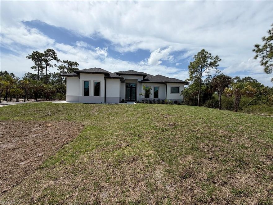 NEW CONSTRUCTION .......BEAUTIFUL 3 BED + DEN , 2 BATH AND 2 CAR GARAGE SITS ON 2.5 ACRES LOT........THIS BRAND NEW HOME ALSO FEATURES A BRIGHT & OPEN FORMAL LIVING & DINING ROOM,IMPACT WINDOW,GRANITE COUNTER TOPS, STAINLESS STEEL APPLIANCES, TILE FLOOR WITH SPLIT BEDROOM, WALK-IN CLOSET IN MASTER BEDROOM, TRAY CEILING, AUTOMATIC IRRIGATION SYSTEM , ASPHALT DRIVEWAY ,AND MORE....BRING YOUR FAMILY AND YOUR PETS AND MAKE THIS HOME AN AWESOME PLACE TO LIVE . VERY PRIVATE AND CONVENIENTLY LOCATED NEAR SCHOOLS AND SHOPPING CENTERS.HOUSE IS READY TO MOVE