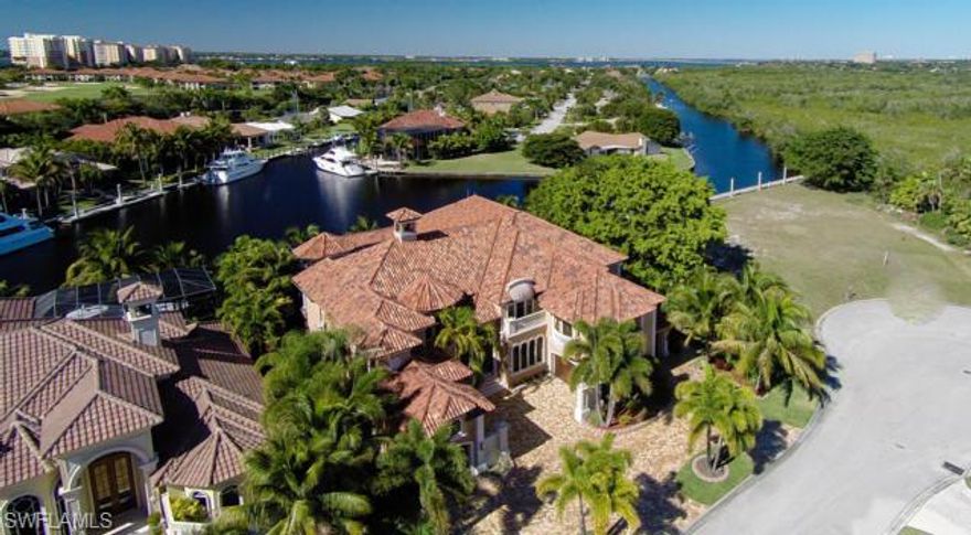 FEATURED ON HGTV – Dream Homes!!This Spectacular “TURN KEY – Totally Furnished” Luxury Residence is Beyond Compare.Deep Water Boating at its Best,accommodating up to 125+ ft Mega Yacht.Minutes out to the Inter-coastal,Bay and Gulf of Mexico. Everything is Custom Built,Designed and Finished in this home.No detail has been left out.Features include State of the Art Electronics,Incredible Home Theater,2,200 bottle wine cellar,Expansive Outdoor Areas for Entertaining with Negative Edge Pool/Spa,Full Outdoor Kitchen,Beautiful Library and Billiards Rms,Fantastic Family/Living,Dining and Kitchen areas.1st Floor Master Retreat with 5 additional Guest Suites.Marble,Onyx,Granite,Wood, Silks,Faux Painting,Gold Fixtures,etc are just some of the finishes used in this amazing property.Located close to everything SW Florida has to offer,dining,shopping beaches, incredible fishing,Major/Private Jet Port and more. A total WOW Factor and one you must see if looking in SW Florida.