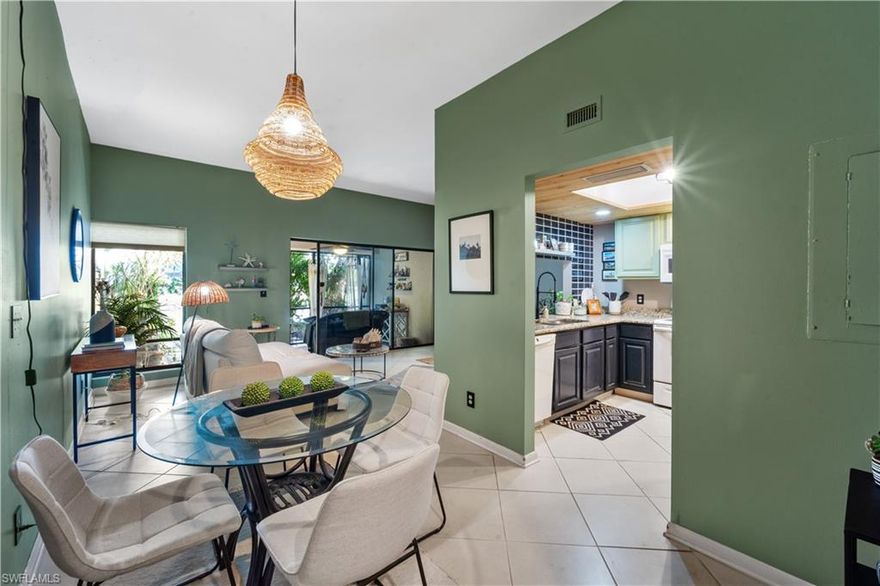 GORGEOUS LAKEVIEW, FRACTION OF THE PRICE! SELLER LOOKING AT ALL OFFERS! | Welcome to 8805 Lateen Lane #103 | Discover this beautiful ground-level condominium, ideally situated close to the sunny and sandy Sanibel Island and Fort Myers Beach. With no stairs to navigate, accessibility is a breeze. The backyard oasis offers serene & picturesque lake with a tranquil fountain feature - perfect for relaxation. Enjoy a private outdoor garden area and screened-in lanai - great for unwinding as the sun sets. Recent upgrades feature laminate flooring in the master bedroom and charming shiplap accents in the bathroom and kitchen. The volume ceilings in the living/dining area and master bedroom create a spacious, airy feel. This condo includes a designated covered parking spot right out front for your convenience. NO FLOOD FROM MILTON, HELENE, IAN OR IRMA! -  | Paddle Creek is close to Lakes Park, beaches, dining, theaters, Southwest Florida International Airport, and more. Don't miss this fantastic opportunity to own a piece of paradise in a prime location! Schedule your showing today!