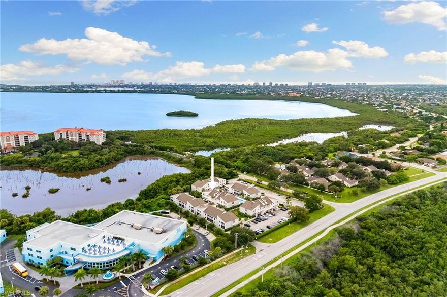 Experience island living in this two-bedroom, two-bath condominium. Ideal as either a seasonal residence or an investment opportunity, this second-floor end unit features ample natural light, an open kitchen with white cabinetry and the convenience of in-unit laundry. The living and dining areas offer a comfortable space to relax, while the screened balcony is accessible from the living room and main suite. Residents enjoy access to a heated community pool in the tranquil Estuary I development, which features lush natural surroundings and has been updated with impact-resistant windows and stucco exterior. Ideally near restaurants, shopping, schools, parks and only a short drive to Marco's Resident's Beach, this property combines comfort, style and accessibility. The community is pet-friendly up to 50 pounds.