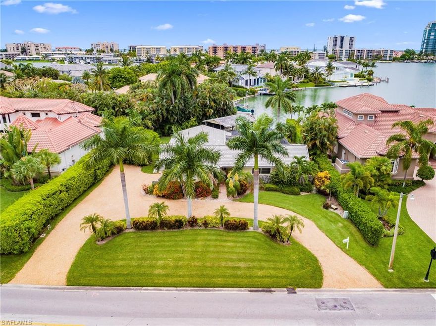 Almost 50 ft. of water frontage with wide open bay views overlooking beautiful Venetian Village. Enjoy stunning sunsets from your western facing lanai with solar heated pool. Boaters will enjoy the covered boat dock and quick Gulf access via Doctors Pass with just one bridge. Close to Venetian Village, Waterside Shops, and downtown Old Naples. The voluntary Moorings homeowners association gives residents exclusive access to a private beach park on Gulf Shore Blvd S. The home has recently been partially remodeled and has a brand new custom kitchen. Being sold as-is, with right to inspect.