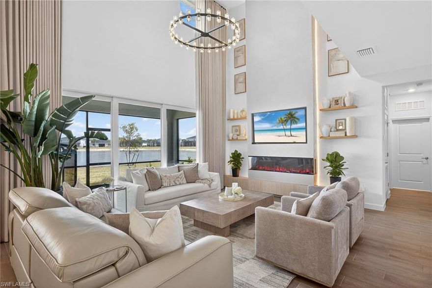 One of the last available Majestica models to be built in Tucker’s Cove, this exceptional lakefront residence is truly one of a kind and poised to move quickly. Unlike a blank builder-grade home, this property showcases thoughtfully curated, value-driven upgrades that create a refined, modern organic luxe aesthetic throughout. A dramatic two-story fireplace with custom shelving and warm LED backlighting anchors the main living space, blending architectural presence with inviting warmth. Layered textures, elevated designer lighting, and luxury window treatments add depth, softness, and sophistication while maintaining a clean, organic feel. The open-concept layout captures breathtaking lake views, creating a serene and natural backdrop for both everyday living and elevated entertaining.

Beyond the designer finishes, this home offers substantial behind-the-scenes upgrades that add long-term value and future cost savings. The seller invested $15,000 in a professional pool pre-wire package — a significant enhancement that directly reduces a future buyer’s pool construction costs. Additionally, a whole-home reverse osmosis water conditioning system has been installed, delivering purified, high-quality water throughout the residence. This system improves taste and clarity, reduces mineral buildup, protects plumbing and appliances, and serves as another thoughtful, value-driven upgrade.

Tucker’s Cove itself is a gated enclave offering its own exclusive, private resort-style amenities available only to its residents through the neighborhood HOA. These highly sought-after, waterpark-inspired amenities are currently underway and will provide an elevated lifestyle experience within an intimate, secure setting. A YouTube amenity animation link is included in the MLS listing so you can preview what is coming to Tucker’s Cove and fully experience the vision for this exceptional neighborhood.

Located within the award-winning, solar-powered town of Babcock Ranch, residents enjoy a vibrant, golf-cart-friendly lifestyle designed around walkability, nature, and innovation. Community amenities throughout Babcock Ranch include multiple neighborhood pools, expansive parks and playgrounds, sports courts, scenic walking and biking trails, green spaces, waterfront dining at Founders Square, live music events, farmers markets, a coffee shop, retail conveniences, medical facilities, and top-rated schools — all contributing to the town’s unique blend of small-town charm and forward-thinking design.

This is more than a home; it is a rare opportunity to own a design-forward lakefront property in one of Babcock Ranch’s most desirable gated communities.