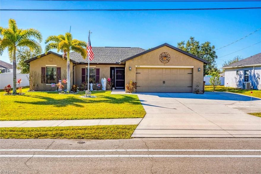Fantastic Opportunity to Live in this Highly Sought After Area of Cape Coral. Located Close to Shopping, Restaurants and Schools with Easy Access to all Major Roads. This 2018 3Bed 2Bath LGI Fiesta Model has been Lovingly Cared for and Shows Pride of Ownership with Beautiful Curb Appeal. The Front Entry has been Screened-In to add Privacy and Provide a Breezeway for those Mild Days. This home has a Split Floor Plan with an Open Concept Living, Dining and Kitchen Area that allows for Easy Entertaining and Functionality. Through the Front Door you Step into a Foyer that Opens to the Living Room with Vaulted Ceilings. The Living Room is the Gathering Area, it is Large enough for Multiple Seating Arrangements and the Sliding Glass Door provides Access to the Screened Lanai which adds Natural Light. The Kitchen has Ample Cabinets, with Stone/Granite Counters, a Pantry for Extra Storage and an Island for Extra Seating. The Dining Area is Open to the Kitchen and Invites Cooking and Conversations with The Chef while offering a Great Space that will Accommodate Most Table Sizes. On this side of the home you will Find Two Nicely Sized Guest Bedrooms, each Carpeted with their own Closets, They share the Second or Guest Bathroom that has a Tub/Shower Combo. The Owner's Suite is Oversized and Carpeted with its Own Ensuite Bathroom with a Full Sized Shower. The Owners Walk-In Closet is a Bonus and has Additional Shelving. The Laundry Room is located just outside the Owners Suite, a nice Convenience. Let's Explore the Lanai with a Massive Area of 20X30 sq ft. All Screened-In with an Insulated Pan Roof. A Great Room for all Your Family and Friends to Gather. Just Imagine How You Can Use All this Extra Space. You can Also Enjoy the Open Air Patio, Large enough for Extra Seating and All your Outdoor Cooking. This Home Has upgraded Lighting and Fans throughout. The Garage is Oversized at 21x20 sq ft with a Generator Plug. Now Let's Cover the Exterior Highlights That Include New Roof 2023, Mature Landscaping with Fruit Trees, an Oversized Driveway that can Accommodate Parking Extra Vehicles, a Boat, Trailer or an RV. A Bonus is the RV Plug has already been Installed. This could be Your New Home! Make an Appointment!