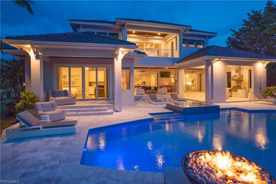 An exceptional Naples contemporary residential masterpiece now offered Furnishings negotiable (see remarks below) that rests on the bay with astounding western exposure views. Designed by Architect Don Stevenson featuring an expansive great room with seamless flow throughout both floors. A spacious kitchen, with a large marble island and the finest Thermador appliance package throughout. Views galore from all the rooms, terraces, out door kitchen and of course the pool area. Outdoor gathering & entertaining with a summer kitchen under an expansive covered loggia with areas for relaxing & dining outdoors. The grounds also include stunningly manicured palms, banyans & privacy hedges.