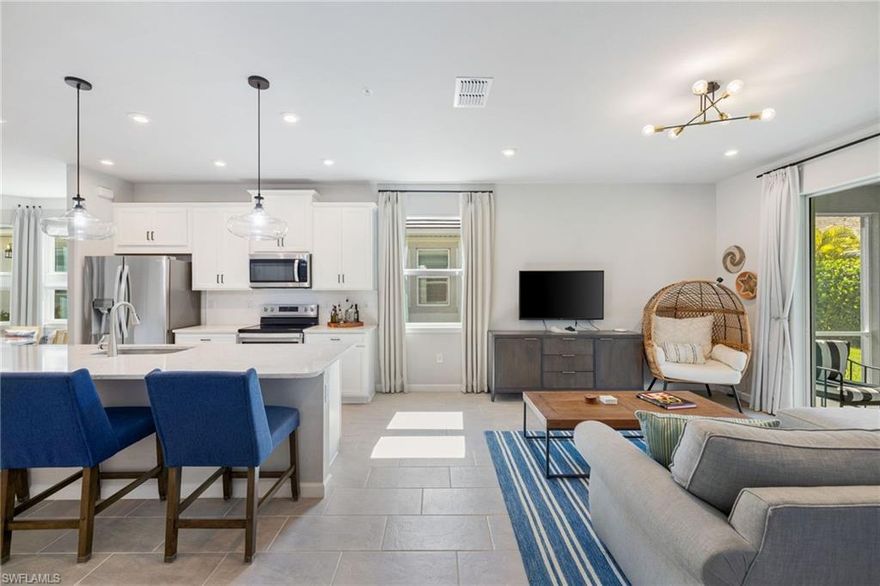 Welcome to your oasis at this bright end unit in Naples, FL! This charming home features 2 bedrooms and a versatile den/flex space, 2 full baths, along with the largest lanai floor plan in the community. With a two-car garage and a private patio, comfort is at your fingertips. Enjoy modern lighting and stationary draperies in the living area, complemented by a large island in the kitchen. Ideally located, you're less than a mile from the National Pickle Ball center, near the Botanical Gardens, and just less than 10 minutes from 5th Avenue and pristine white sandy beaches. Community amenities include a resort style pool and hot tub, gym, and dog park. This ground-floor gem nor the community has never been flooded. Embrace the comfort and convenience of this exceptional home!