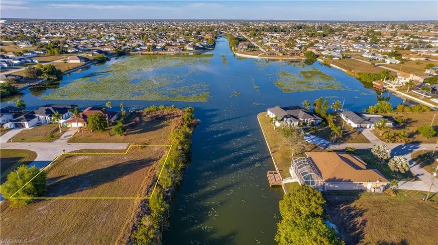 Prime freshwater lot on Quantico Canal, just steps from Lake Holiday! This oversized property is privately located on a dead-end corner lot and sits on a wide canal with a view of the lake, offering the perfect setting to build your dream home or invest in a prime piece of Cape Coral real estate. This remarkable single-family lot is situated in one of Florida's most sought-after and rapidly growing regions. Enveloped by newly constructed, contemporary homes, this community exudes a warm and upscale ambiance. The lot provides ample space for indoor and outdoor living, with tranquil waterfront views right from your future backyard. No flood insurance needed (low-risk Flood Zone X), giving you added peace of mind and potential savings. Enjoy the peaceful ambiance while still being close to major roads, shopping, dining, schools, and recreational facilities. Don’t miss your chance to create your perfect slice of paradise on this gorgeous lot!