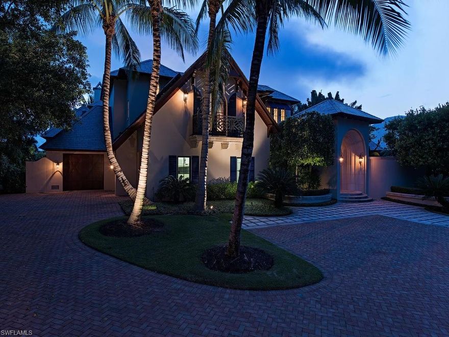 Beautiful private estate.  This custom home was designed by Harrell & Co. architects and built by BCB.  Hand scraped walnut floors with extensive mill work.   Electric powered sliding glass doors seamlessly join the indoor and outdoor living areas.   The lush landscaping provides privacy around the disappearing edge pool & spa.  Great outdoor entertaining with fireplace and outdoor kitchen.  Electric shutters and screens for the lanai.  Quick access to the Gulf Of Mexico from your 65 ft dock.  Immediate membership to The Port Royal Club available.