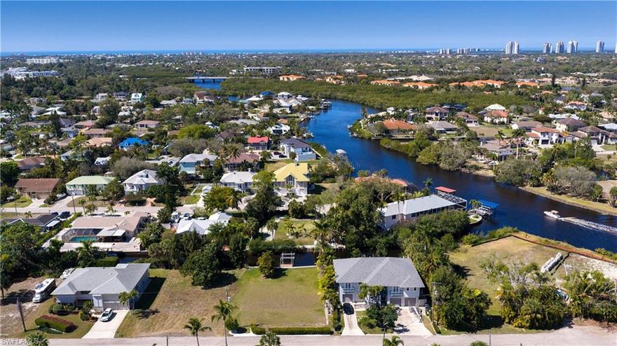 0.22-ACRE GULF-ACCESS LOT WITH A PRIVATE BOAT DOCK & BOAT LIFT, BOTH BRAND-NEW IN 2025! Enjoy scenic boat rides to the Gulf via the gorgeous Imperial River. This 80 x 120 lot is on a peaceful & beloved street with prime West rear exposure for spectacular sunset views over the waterway & ideal sun on your future dream pool. Offers rip rap seawall with a newly replaced bulkhead! This cleared & sodded lot already has electric, water & sewer hook-ups in-place, saving the future owner THOUSANDS in impact fees! Perfectly located 15 minutes to Barefoot Beach & Bonita Beach, less than 10 minutes to Coconut Point Mall & just minutes to thriving "downtown Bonita Springs"  a developer hotspot with fantastic new local restaurants, cafes & shops, Riverside Park (which hosts festivals & concerts), a brand-new library, a brand-new food truck park, Sugarshack live music cafe, & historic attractions such as Shangri-La Springs & the Historic Wonder Gardens. Easy access to RSW via I-75 or Imperial Parkway! Survey available!
