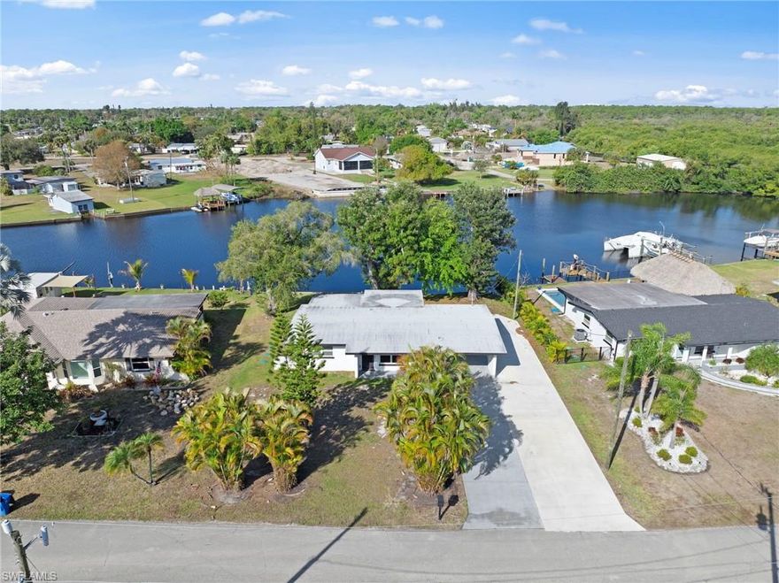 Enjoy the best of Southwest Florida living in this charming canal-front home with amazing water views! Tile flooring throughout, updated kitchen with quartz counters and painted wood raised panel cabinets. Bring the boat, bring the RV — there’s room for it all with a large concrete pad perfect for your toys and extra parking. Tucked away on a quiet dead-end street, this property offers a peaceful setting where you can relax, fish, or watch manatees right from your backyard. Inside, the home features a bright, light-filled living space with an open layout designed to capture beautiful water views and that laid-back coastal vibe. Whether you’re entertaining guests or enjoying a quiet evening at home, you’ll be reminded every day why you chose to live in paradise. Conveniently located just minutes from downtown Fort Myers, marinas, shopping, and local dining, this move-in-ready home makes waterfront living simple, comfortable, and fun.