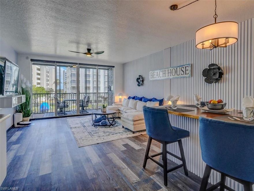 TURNKEY FURNISHED Hibiscus Pointe 2BR/2BA unit with spacious eastern exposure lanai. There's nothing for new owners to do but unpack! • All new modern furnishings, light fixtures and remote-controlled ceiling fans w/lights. • Luxury vinyl plank tile flooring throughout. • Custom zebra shades. • Fluted wood accent walls throughout. • Kitchen: Frigidaire Gallery and Whirlpool appliances; open shelving; full height tiled backsplash with Morrocan-style tile accents; stainless steel sink w/high arc touchless faucet; Acacia wood butcher block countertops with dining extension; lighted tray ceiling. • Main living area features a custom built-in cabinet with beverage cooler and wall-mounted electric fireplace. • Owner's suite has direct eastern exposure lanai access, LED-lit king bedframe, spacious walk-in closet • Owner's en-suite bath: backlit anti-fog mirror; 72” dual sink vanity with marble countertop; full-height tiled shower frameless glass doors and rain head). • Western exposure guest bedroom has a clever queen bed/twin loft combo to accommodate guests. • Guest bath updates: vanity; backlit anti-fog mirror; refurbished tub; folding glass shower door; tile w/decorative accent. • Spacious screened lanai (w/wall-mounted TV) runs the length of the unit. • In-unit laundry combo. • Convenient under-building parking. • Enormous storage locker located on unit floor! • Located in popular, south end Bay Beach community surrounded by canals. • Hibiscus Pointe amenities include pool, community room and spa, deeded beach access, fishing pier • Bay Beach Commons amenities: paths; chipping and putting greens; driving cage; pickleball courts; bocce ball courts; tennis courts; tiki huts • Direct TV & internet are included in the quarterly fees. • Boat docks may be available for lease/purchase in Bay Beach area. This is an amazingly redone unit you simply must see!