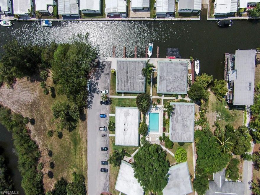 C.13529 Boater's Dream!! Amazing location right on the canal with deeded boat dock and NO bridges to the Gulf.  Only 1 mile away from Gordon River.  Open floor plan - Bright and Sunny!  Oversized Master with a walk-in closet.