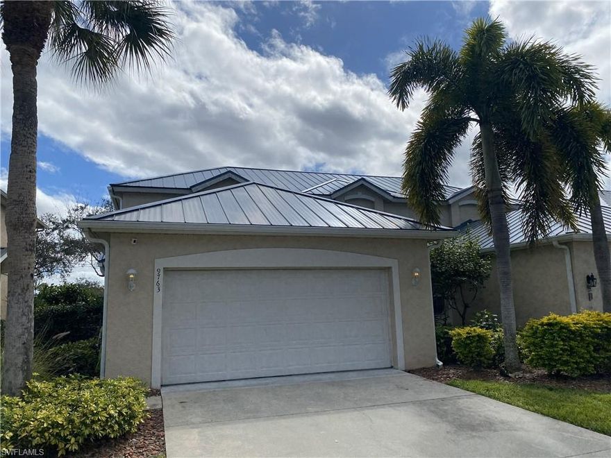 Discover 9763 Glen Heron Drive, a stunning home situated in the sought-after community of Cockleshell Village, with only 44 Single Family Homes and very low HOA's. This meticulously cared-for two-story residence boasts three bedrooms, with the Master on the first floor.  Two and a half baths, and nearly 1,800 square feet of elegant living space. After three recent hurricanes this home has not history of storm damage or flooding. Step inside to find a sophisticated yet welcoming interior, where open living and dining areas are illuminated by abundant natural light and adorned with classic finishes. The main level showcases neutral tile flooring that flows seamlessly throughout, complemented by designer lighting fixtures and stylish accents to create a refined atmosphere. The chef-inspired kitchen features sleek white cabinetry, elegant granite-style countertops, stainless steel appliances, and a chic modern backsplash that marries style with practicality. The first-floor primary suite serves as a serene retreat, featuring hardwood flooring, a spacious walk-in closet, and a beautifully designed en-suite bath. On the upper level, you'll find two additional bedrooms and a versatile loft space perfect for guests or as a media room or home office. Fresh flooring has just been installed in the master bedroom and closet! Outdoor living is just as impressive, featuring a screened lanai and an extended patio that overlooks lush landscaping—an ideal spot for al fresco dining, entertaining, or peaceful relaxation. An attached two-car garage adds convenience to this thoughtfully designed home. Located just off of Business 41 on a private road with low HOA fees, this property combines exclusivity with incredible value. Enjoy a central location just minutes from Bonita’s beautiful Gulf beaches, Hertz Arena, and the new local high school offering accredited college-credit programs. Upscale dining, shopping, and major thoroughfares are also within easy reach.