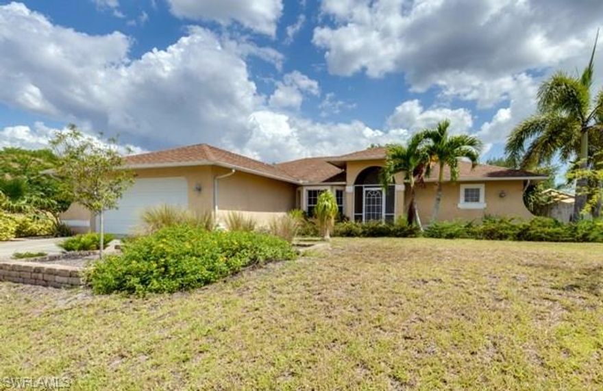 Look no further! Your perfect home is here. This charming home is not your average cookie cutter house. A split floor plan design with a great room/dining area combination. A screened front portico leads to a double door entry. The great room offers vaulted ceilings,  a beautiful dining area with a bay window and glass sliding doors out to the lanai. A galley style kitchen features tons of cabinet space, stainless appliances and a breakfast nook that overlooks the lanai and garden. Outside you will find a tranquil oasis! The screened lanai is huge and spans the back of the home. Just outside of the lanai is a tranquil patio area perfect for outdoor entertaining or just enjoying the wonderful Florida weather. The master suite has sliding doors to the lanai, a large walk in closet, dual sinks and a large walk in shower. The guest rooms are spacious and separated by a good sized guest bath that also has dual sinks. The third guest bedrooms is currently being used as a den. Conveniently located to schools, shopping, restaurants and all the Cape Coral has to offer. This is that property that you will just fall in love with at first sight. Schedule your exclusive showing today!