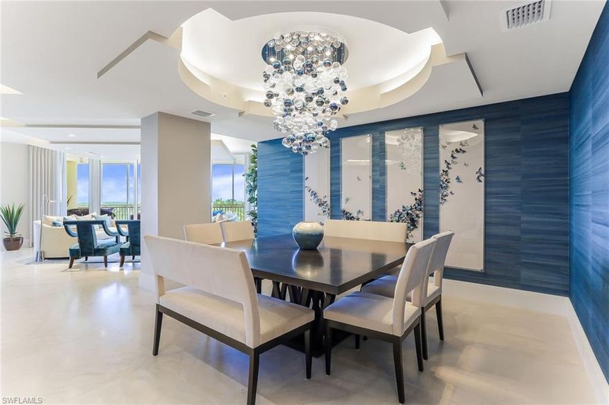 TURNKEY FURNISHED, INCLUDES A 55' BOAT SLIP IN THE AQUA MARINA & MEMBERSHIP TO PELICAN ISLE YACHT CLUB. This spectacular residence is waiting for you in the new tower at Aqua. Award-winning interior designer Renee Gaddis has created beautiful, classic and sophisticated contemporary elegance with walls of glass offering expansive views of the marina, Wiggins Pass and the Gulf. Enter and be awed by the dramatic blue/greens of the Gulf of Mexico reflected in the interiors. Amazing design details and custom luxurious finishes make this 4,131 square foot, 4-bedroom, 3-1/2-bath residence an absolute showstopper and outstanding value. The re-designed expansive gourmet kitchen features double ovens, quartz countertops, wine refrigerator and a gas cooktop, all top-of-the-line. This open concept floor plan features electronic shades, a linear fireplace and travertine marble flooring throughout. Included are upgraded lighting systems, custom one-of-a-kind chandeliers, commissioned art. Two parking spaces and 24-hour concierge are but a few of the many amenities offered. This property is unique in every way.