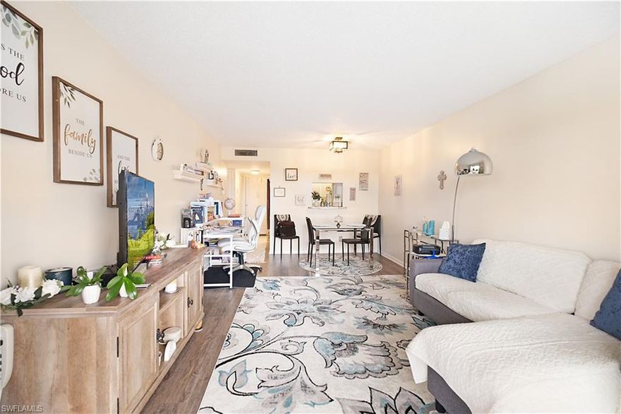 Resort living at its finest in the highly desirable Fairways community, a vibrant 55 plus community perfectly positioned off Collier Boulevard in East Naples with convenient access to everything Southwest Florida has to offer. This beautiful spacious 1 bedroom 1 bath condo is located on the top floor of a 4 story building so no one above you and features spectacular views of the newly installed 9 hole public golf course from your screened-in, covered lanai where you can watch stunning Naples sunsets and enjoy the peaceful Florida lifestyle. This building is the only one in the complex with elevator access while all the 2 story units require walking up stairs for access. The kitchen is adorable with white appliances and neutral cabinetry plus a convenient pass-through to the dining area that makes entertaining effortless. Gorgeous luxury vinyl flooring flows throughout the main living areas while the spacious bedroom showcases beautiful golf course views, plush neutral carpet, and a deep walk-in closet providing ample storage. The bath features tile flooring, white cabinetry, cultured marble countertops, and shower. The generous living great room features pocket sliders opening to the large lanai with stunning golf course views creating the perfect indoor-outdoor living space. Additional features include a stackable washer and dryer for convenience, impact glass, customized hurricane rated electric screens for peace of mind, extra storage in the hallway, and a retractable screen door to take advantage of wonderful warm Florida breezes. Mailboxes and elevator are conveniently located for easy access to your floor. All of the exceptional amenities are walking distance from the condo and include ample guest parking, clubhouse with social activities, sparkling pool, bocce court, covered dining area, bike racks, grill and picnic area, tennis court, pickleball court, and outdoor patio area all surrounded by a park-like setting near the lake with fountain features creating a serene retreat. This East Naples location puts you minutes from Publix and Walmart on Collier Boulevard, Collier Plaza with its array of restaurants and services, Naples Coastal Shoppes for upscale shopping, and easy access to Interstate 75 for quick trips throughout Southwest Florida. Downtown Naples with its world famous Fifth Avenue South shopping, dining and entertainment is just a short drive away, along with pristine Gulf beaches including Naples Pier and Vanderbilt Beach where you can enjoy spectacular sunsets over the Gulf of Mexico. Southwest Florida International Airport is approximately 30 minutes away making travel convenient. The location also provides access to beautiful regional parks including Sugden Regional Park with its 60 acre Lake Avalon, North Collier Regional Park with extensive sports facilities and walking trails, and the natural beauty of nearby preserve lands perfect for outdoor recreation.