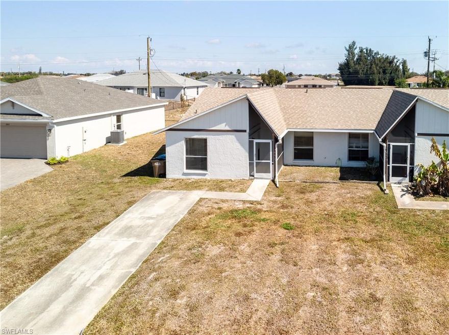 2 bedroom 2 bath plus bonus room duplex is conveniently located in NE Cape near Andalusia & Diplomat. Be welcomed by the large screened entry. Brand new wrap-around kitchen with granite counters opens to the great room for family conversations. Enjoy the bonus room however you choose.... office, den, exercise or additional entertainment room. Primary bedroom features two closets & en suite bathroom .New A/C & new water heater for efficiency with electric. The unit is all tile including the lanai. Vaulted ceilings provide a spacious, open feeling Private laundry located on lanai. Nice open back yard. Easy to see!