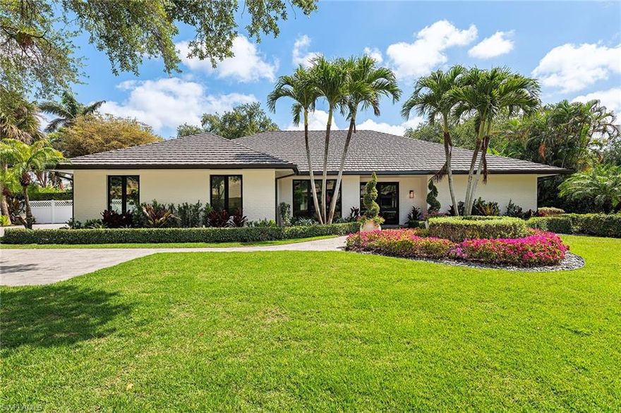 Tropical ambiance is abundant in this one-of-a-kind, completely renovated home in the heart of the prestigious beachfront community of Pelican Bay. Design selections curated by Collins DuPont effortlessly blend timeless Floridian charm with modern luxury. Step outside to your private oasis, where an expansive pool area, surrounded by lush landscaping, creates a backdrop for relaxation and entertaining - Complete with an outdoor kitchen and a spacious covered living area, inclusive of remote-controlled retractable screens. Light-filled and breezy, the home features all new high-impact glass, a chef's kitchen with Thermador appliances and a Sonos sound system throughout. The generously sized lot, private fenced yard and mature landscaping, along with secluded outdoor sitting areas, all enhance the feeling of privacy. Pelican Bay offers resort-style amenities with private access to three miles of white-sand beaches, sailing, kayaking, beachfront dining, a robust tennis program, a state-of-the-art fitness center, as well as recreational trails and parks across 88 acres of nature preserve.