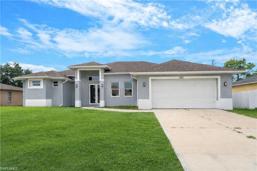 Welcome to this brand-new 2024 construction home located in the heart of Lehigh Acres, now available for rent. This stunning 3 bedroom + den, 2 bath residence features a modern open floor plan with elegant gray tile flooring throughout and tray ceilings that enhance the bright, airy feel of the home. The spacious great room flows seamlessly into the beautifully designed kitchen, complete with soft-close cabinets, granite countertops, stainless steel appliances, decorative backsplash, and an oversized island, ideal for entertaining or everyday living. The home offers two master suites, each with walk-in closets, dual sinks, and walk-in showers, providing privacy and flexibility for families or shared living. Large windows and recessed lighting fill the space with natural light, while the open lanai overlooks a peaceful freshwater canal, creating the perfect outdoor retreat. Built with solid concrete block construction, this property includes an attached 2-car garage, well and septic system, and sits on a generous lot with room to enjoy outdoor living. Located in a quiet area yet conveniently close to shopping, schools, and major roadways, this move-in-ready rental offers the perfect blend of modern style, comfort, and space.