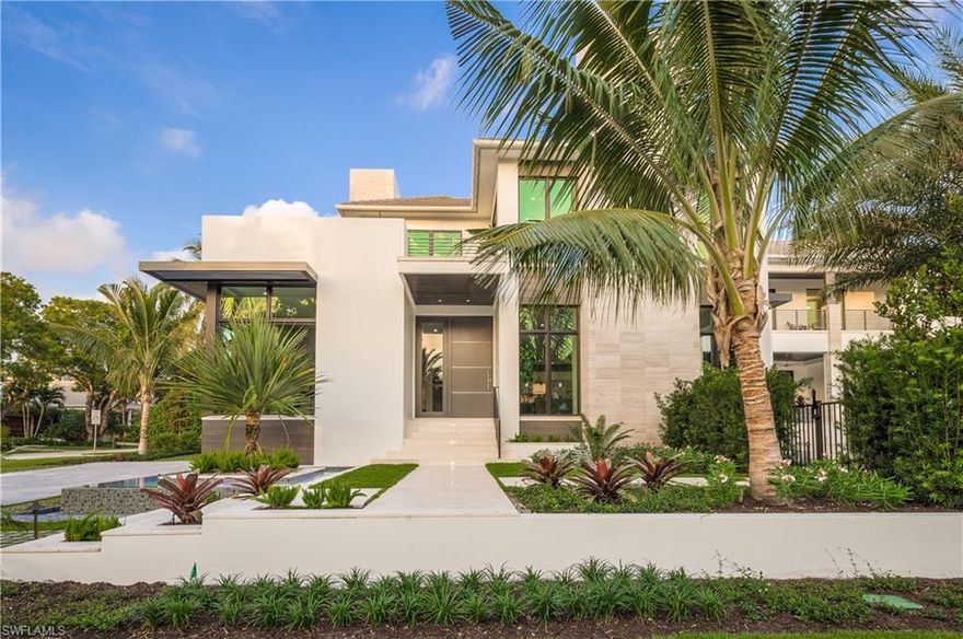 Recently completed, this gorgeous one-of-a-kind 5896* sq. ft. under air (7953* sq. ft. total) home is perfectly located in the heart of Olde Naples, just 2 homes from the beach and 2 blocks from 5th Avenue South. The home features exquisite interior finishes, four full bedrooms including two master suites, a den (or fifth bedroom), loft, five full baths, one half bath, an elevator, and an extensive pool complex with spa, outdoor kitchen and bar, outdoor fire pit and lounge. Inside, the stunning kitchen includes ample storage and appliances such as a 60-inch duel fuel Wolf range, a 60-inch Subzero refrigerator/freezer, two pullout refrigerator drawers, two dishwashers, a warming drawer, coffee maker, steam oven, microwave and walk-in pantry. The bar includes an icemaker, two 30-inch full height wine coolers, a beverage center and a Dacor wine dispenser. The spectacular great room capitalizes on views of the pool area and includes 12-foot ceilings and a linear fireplace with polished quartz surrounds. In addition, the property features a second story turf deck and a full 3.5-car garage with access to 2.5.  Spectacular southwestern exposure adds to the perfect resort-style experience.