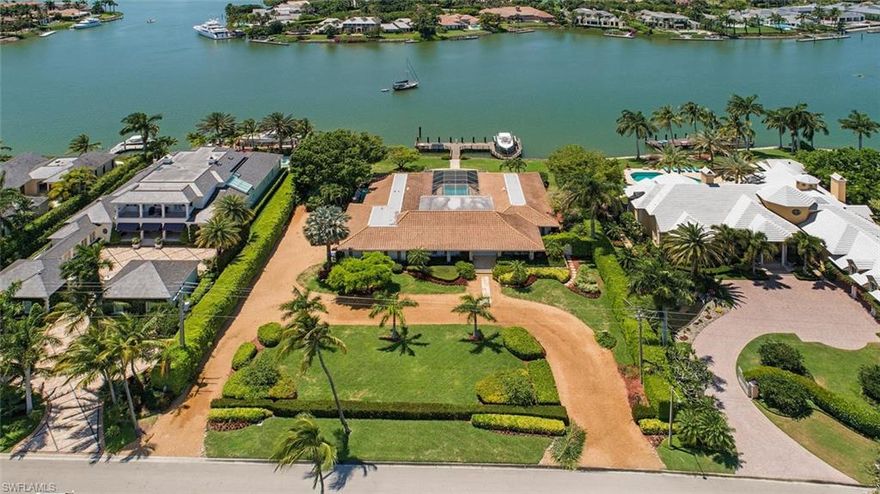 H.1359 - Much desired Western exposure and beautiful, expansive water vistas at the widest part of Man-O'-War Cove! Oversized lot and a half has approximately 155 ft. of waterfrontage and boasts 36,590 sq. ft. for your future dream home. Just a short distance to the prestigious Port Royal Club on the beach for world-class dining, tennis and fitness facilities, with immediate membership eligibility. Direct Gulf access from your private dock. Charming older home is being sold "AS-IS".
