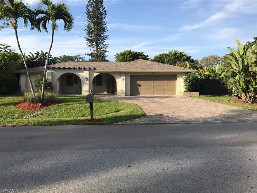 Come see this special home on a wide canal (there is a boat ramp within the community with gulf access!) in Coconut River Estates, the most affordable single family home neighborhood of its kind. NO HOA FEES! This COMPLETELY RENOVATED AND REDESIGNED 3 bedroom, 2 bathroom, SALT WATER POOL home is characterized by clean lines, open space, and expansive walls of glass to seamlessly blend the inside with the outdoors and fill this home with natural light. The great room living area opens to the outdoor living space overlooking a lushly landscaped and private, fully fenced, .26 acre yard on a canal with 14 x 28 salt water pool. The home is in a central location, minutes to shopping, three miles to Downtown and the beach. COMMUNITY BOAT RAMP WITH GULF ACCESS. Review in the supplements the List of Special Features of this home - too many to list!