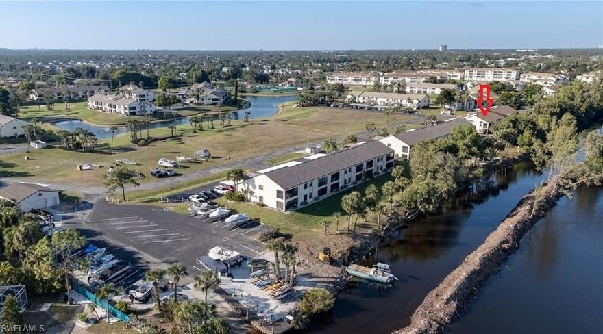 From the second floor lanai, enjoy the serene water and wooded views, as the east west style layout captures a soft cross-breeze. Notable upgrades include 2020 AC system for year-round comfort, and a kitchen and bath remodel completed in 2024. The main living area is open and inviting with a spacious pass through to the kitchen that makes cooking feel fun and connected. The community has an impressive list of amenities, including Gulf-access and storage for those with a boat, a pool/hot tub with bar, restaurant, community events, exercise room, golf course, pickleball, and tennis courts. Practical updates and fun community features combine to offer comfortable Southwest Florida living.