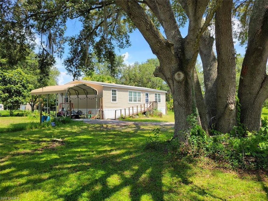 Very nice three bedroom, two bath home located on an oversized .64 lot, with carport and storage shed, fruit trees, large old growth Oaks, and a fenced back yard!  Located in Horseshoe Acres, between LaBelle and Clewiston just off of SR 80 and near the Glades Golf Resort and Marina.  Built in 2019 this home features vinyl flooring throughout, an open floor plan, spacious master suite, newer stainless kitchen appliances and much more! Schedule your appointment today!