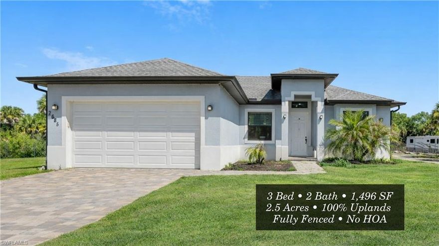 Located in Golden Gate Estates, this well-maintained 3-bedroom, 2-bath residence offers approximately 1,500 square feet of living space on 2.5 acres of 100% upland property, providing full usability and flexibility with no HOA restrictions. The front portion of the property is fully fenced and cleared, creating a private and functional space ideal for everyday use.

Built in 2020 with concrete block construction, the home features impact-resistant windows, tile flooring throughout, and a practical split-bedroom floor plan designed for comfortable living. The interior includes a bright living area, eat-in kitchen, and a spacious primary suite with dual sinks and a walk-in shower.

One of the guest bathrooms offers direct access to the lanai, functioning as a convenient pool bath, adding flexibility for future outdoor living. Additional features include recessed lighting, laundry in residence with utility sink, and an attached two-car garage.

The property includes underground electric service, well water, septic system, irrigation, and an automatic sprinkler system. The expansive acreage provides ample room for outdoor living, additional structures, or future improvements while maintaining privacy.

Conveniently located with easy access to Immokalee Road, shopping, dining, and everyday amenities, this property offers the space, usability, and freedom that Golden Gate Estates is known for.