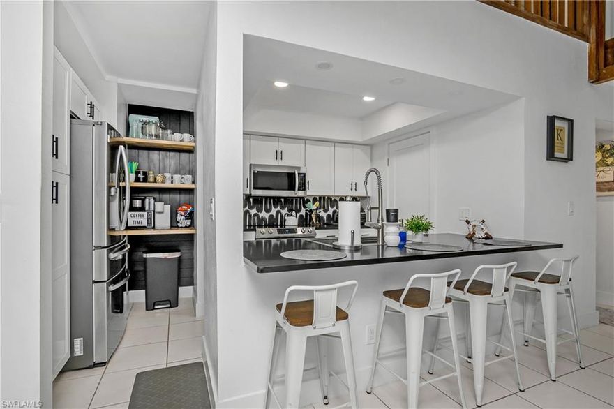 DO NOT MISS THIS OPPORTUNITY! This newly updated three-bedroom, three-bathroom townhouse in Timberwood Village offers 1,680 square feet of sophisticated, unfurnished living space designed with a seamless great room split-bedroom floorplan! The heart of the home is a newly remodeled kitchen featuring white shaker cabinetry with matte black pulls, black quartz counters, stainless steel appliances, a stainless-steel single-bowl sink with a pull-down faucet, a tray ceiling, and recessed lighting complemented by a breakfast bar and extra open shelving. The impressive great room boasts vaulted ceilings, tile flooring, recessed lighting, and a new modern fan, while clever built-in shelving under the staircase maximizes storage. The dining area has a new modern ceiling light fixture and a convenient slider to the screened-in lanai. Throughout the home, you will find a neutral color palette and a mix of tile in living areas with plush carpeting in the bedrooms and loft. The remodeled primary ensuite bathroom features a spacious stylish marble look quartz and wood vanity with a square under counter sink and matte black faucet, sleek oversized lighted vanity mirror, floor-to-ceiling tiled shower with a niche, matte black shower hardware, and recessed lighting. The first-floor remodeled guest bathroom includes a shower/tub combo with a niche, a natural wood vanity with a white quartz counter and under counter sink, matte black shower, vanity, & cabinet hardware, new vanity lighting, and a contemporary matte black round mirror. Upstairs, the versatile loft leads to a private third bedroom and a bathroom with a granite-topped vanity with a glass vessel sink and a floor to ceiling tiled shower with bench seating and a glass shower enclosure. Enjoy private outdoor living on the screened-in, fenced lanai with tile flooring. This property includes one assigned parking space and guest parking. You will love the major structural and system updates, including a NEW ROOF (2021), new plumbing (2021), a new water heater (2021), and a BRAND-NEW A/C SYSTEM (2025). Ideally suited for both homeowners and investors, the community offers flexible rentability with a 30-day minimum and up to 12 leases allowed per year, and is a pet-friendly environment for animals under 40 lbs.