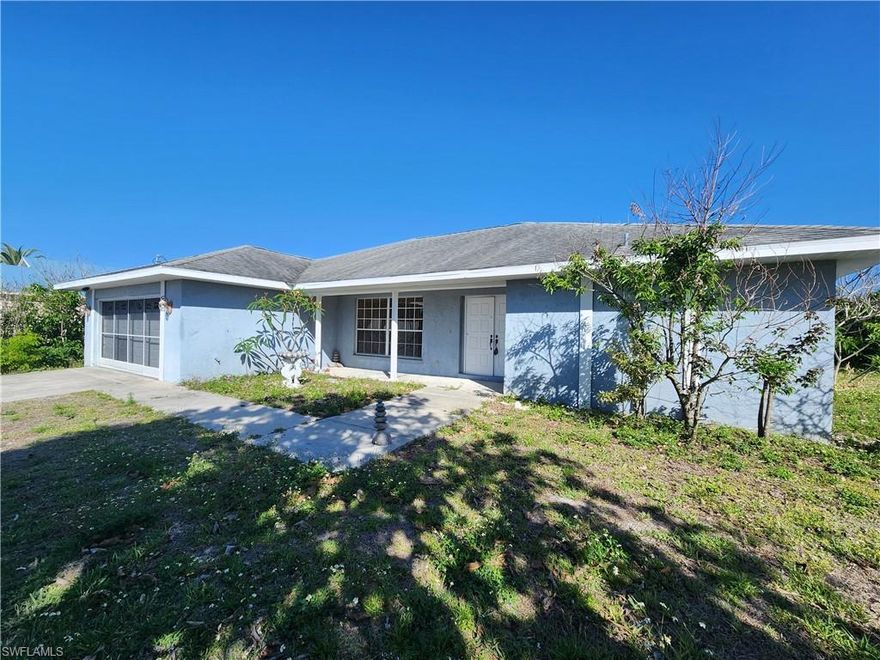 Welcome to this spacious 3-bedroom, 2-bath home located in the desirable Country Club Estates of Lehigh Acres. Offering over 2,200 square feet of living space, this property is a fantastic opportunity for buyers seeking comfort, functionality, and room to grow.

Step inside to discover a thoughtfully designed split floor plan featuring large, inviting living areas perfect for both everyday living and entertaining. The home boasts a great room layout, an eat-in kitchen with island, built-in desk, and pantry, as well as a separate dining area for more formal gatherings.

The oversized primary suite is a true retreat, complete with dual walk-in closets and a spacious ensuite bathroom featuring a garden tub and separate walk-in shower. Storage is abundant throughout the home, with unique features and built-ins adding both charm and practicality.

Enjoy Florida living at its best with a huge screened lanai, ideal for relaxing or hosting guests year-round. Situated on an oversized lot, the property provides ample outdoor space and privacy.

Additional highlights include a 2-car garage, indoor laundry, central electric heating and cooling, and a durable concrete block construction. With no HOA fees or restrictions, you’ll have the freedom to truly make this home your own.

Conveniently located near shopping, dining, and major roadways, this property combines space, value, and location—all at an attractive price point.

Don’t miss your chance to own this incredible home—schedule your showing today!