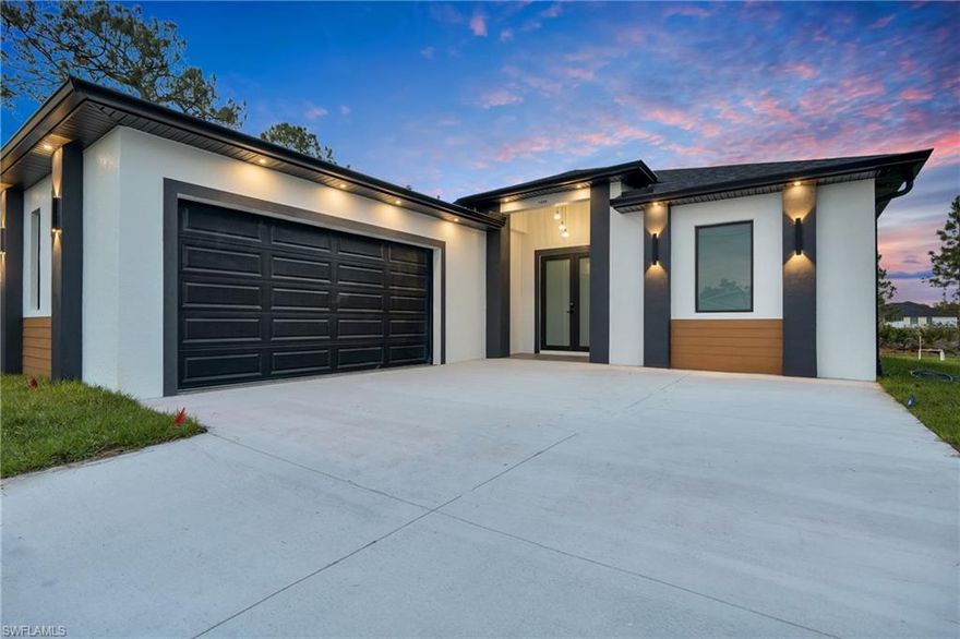 Beautiful home for sale in one of the best location in Lehigh Acres. This modern residence features impact windows and doors, porcelain tile throughout, and elegant, high-end finishes. The kitchen and bathrooms showcase stunning calacatta surfaces, complemented by custom cabinetry throughout the home. Designed with clean, contemporary style, every space feels bright, functional, and refined. This beautiful home features a modern LED lightning design.
The property also includes a fully automatic sprinkler system covering the entire home and yard for easy maintenance. A perfect combination of style, comfort, and location. Make your offer today!!!