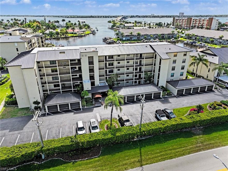 Fantastic 2 bedroom 2 bath with one car garage gulf access condo in Clipper Bay.  This property boasts more than 1000sf of living area, large kitchen with stainless steel appliances, spacious living area, generous sized bedrooms, loads of outdoor living space on the screened lanai overlooking the marina and basin.  Great location that is walking distance to restaurants and shopping and so much more!!  Boat dock available!!