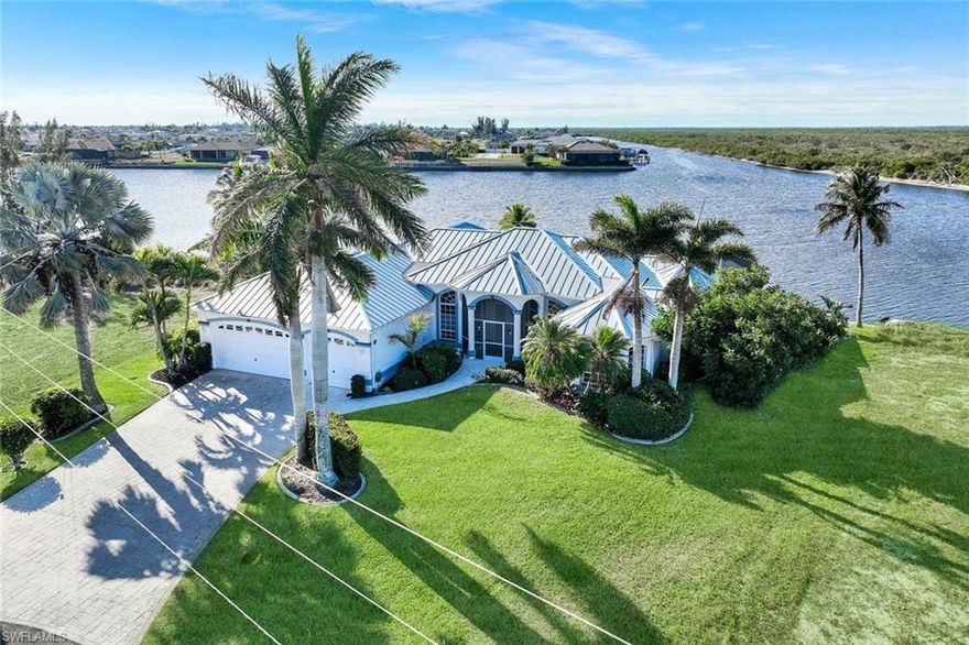 Located in one of the most desirable NW Cape Coral locations, this sailboat-access waterfront home offers over 2,700 sq ft under air, southern exposure, and more than 150 feet of unobstructed water views. The wide canal setting provides privacy, open vistas, and an ideal backdrop for Florida waterfront living.

The 3-bedroom, 2.5-bath layout includes a den/office, offering flexible space for working from home or additional living needs. Generously sized living and entertaining areas are filled with natural light, creating a seamless indoor–outdoor connection.

Built for durability, the home features a double-thickness concrete slab, reinforced construction, and a 24-gauge metal roof installed in 2023. Two separate A/C systems provide efficient climate control.

Outdoor living is highlighted by a 35-ft insulated pool with a no-see-um screened enclosure and pool heat pump (2023) for year-round enjoyment. A rare 3½-car garage includes an extended bay suitable for a mid-size boat, offering exceptional storage and flexibility.

A standout opportunity combining prime location, sailboat access, space, and expansive water views—the complete Cape Coral waterfront lifestyle.