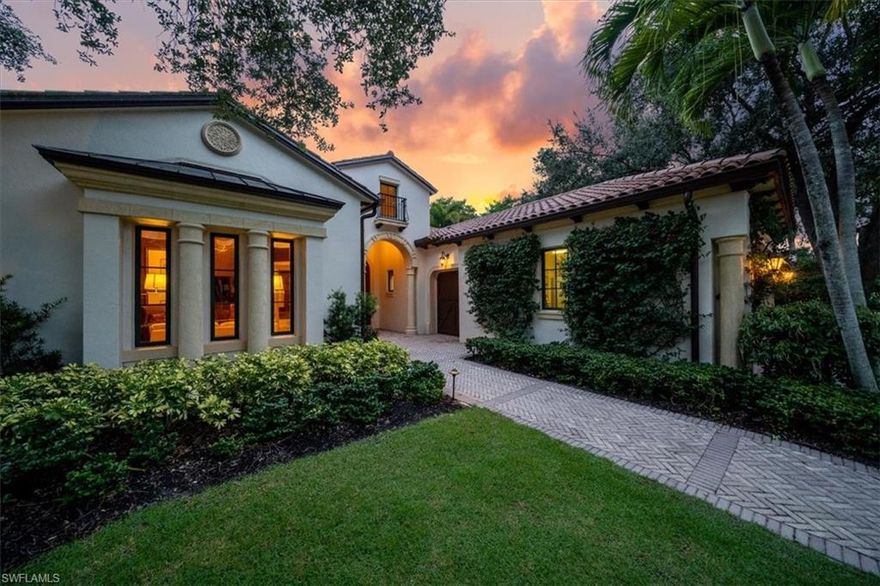 V6857 - GOLF MEMBERSHIP AVAILIBILITY on this former "Emilia" Model that overlooks a glistening lake and the double fairway of the 16th and 17th fairways of the championship Estuary golf course. The floorplan features split bedrooms and a spacious den. Light and bright eat-in kitchen with breakfast bar, separate dining space and large pantry space. Hardwood floors in the den, guest suite and owner's suite. Extensive millwork, casings and ceiling treatments accent this traditionally styled villa. Outdoor living enjoys a covered loggia, summer kitchen, gas fireplace, and a sunshine pool with a spillover spa. Exterior features include professionally designed landscaping and nightscape lighting. Impact-resistant doors and windows and a 2-car garage with a separate golf cart area. The Estuary is located within the city of Naples and is convenient to all of Naples fine dining, shopping, and entertainment.