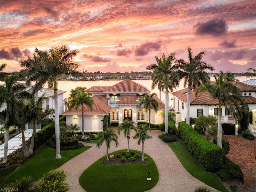 Set on an extraordinary open-water homesite along coveted Kingfish Road in Royal Harbor, this stunning waterfront residence delivers the quintessential Naples lifestyle with spectacular wide-water views stretching across Naples Bay. Offering four bedrooms, four baths, and a private office, the home has been thoughtfully designed to celebrate its exceptional setting, where dazzling western sunsets become part of your daily routine and passing sailboats provide a constantly changing backdrop. Bright, airy interiors are enhanced by soaring ceilings and expansive glass that flood the home with natural light while showcasing the breathtaking bay views throughout. The flowing floor plan was designed with both comfort and entertaining in mind, blending sophisticated living spaces with an effortless connection to the waterfront surroundings. At the center of the home, a beautifully appointed gourmet kitchen is equipped for both casual mornings and elegant evenings, featuring premium appliances, custom cabinetry, a gas cooktop, and a generous island that naturally becomes the gathering place for family and guests alike. Perfectly positioned just minutes from downtown Naples, pristine Gulf beaches, acclaimed restaurants, and upscale shopping, this exceptional property offers a rare combination of open-bay frontage, refined modern updates, and one of Royal Harbor’s most sought-after sunset exposures.